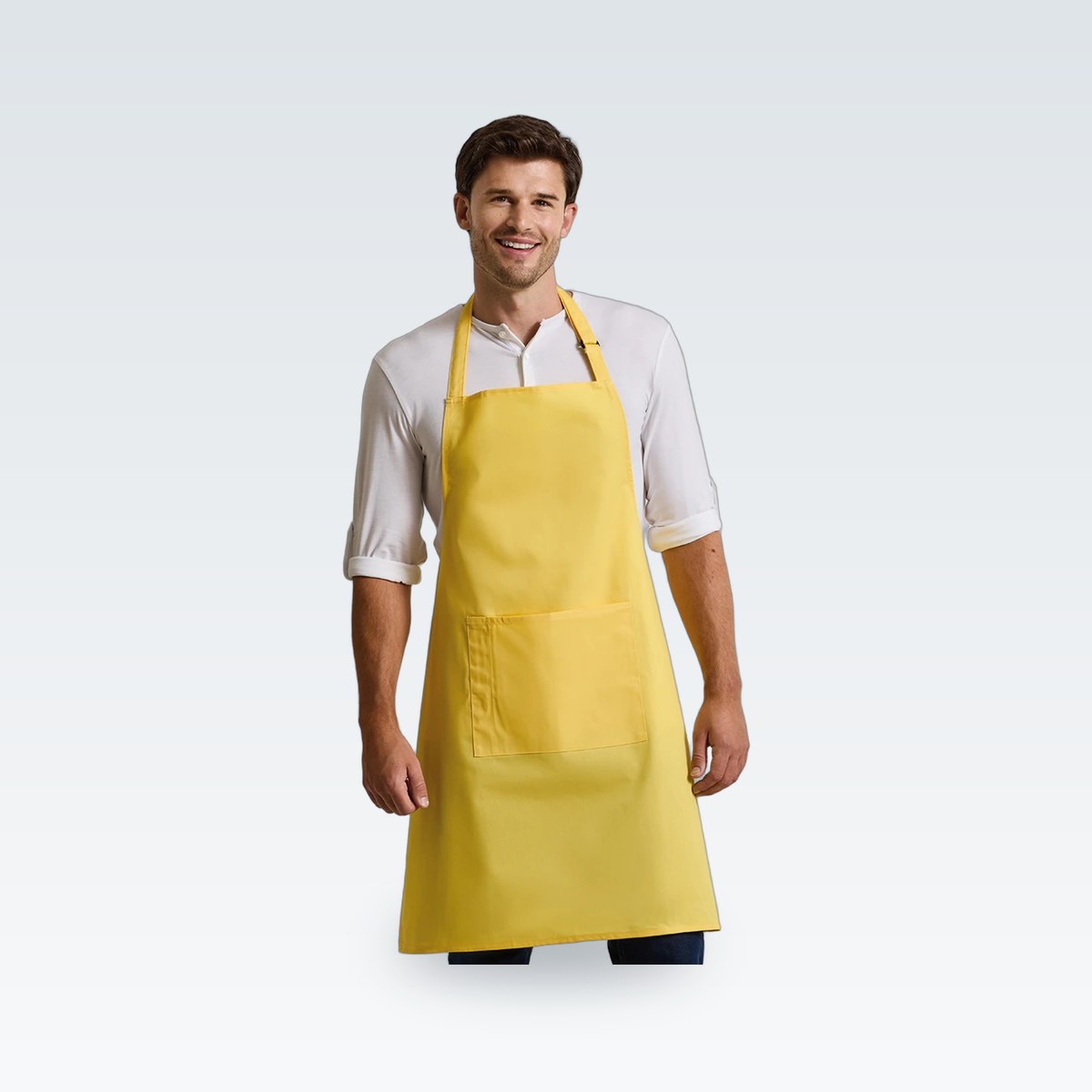 A bib apron worn over a shirt