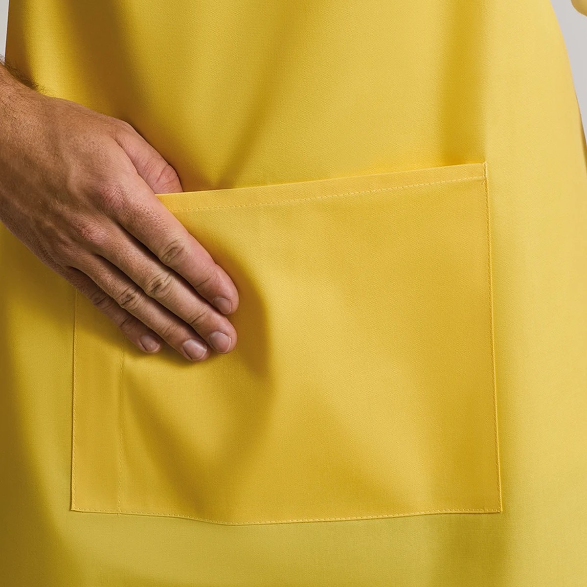 The front pocket of a bib apron
