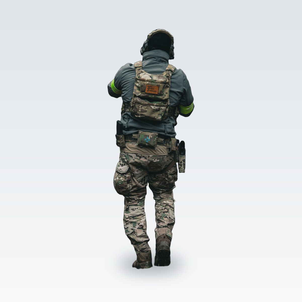 A tactical vest over a field uniform, seen from behind