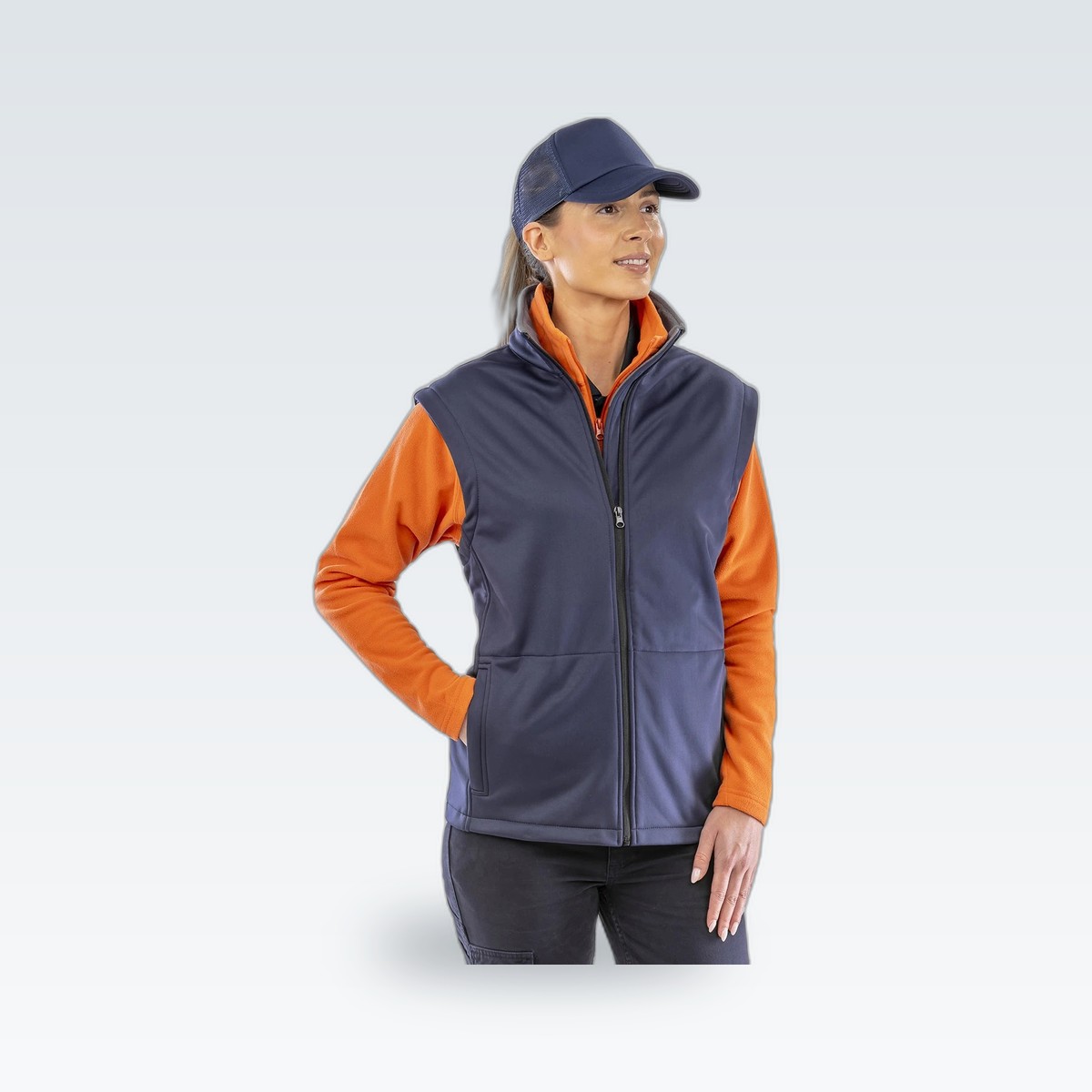 A softshell bodywarmer worn over a work shirt